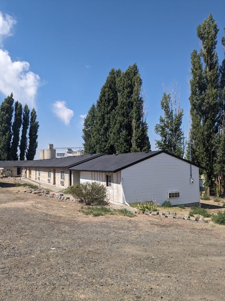 Newly installed shingle roof completed by roofing contractor