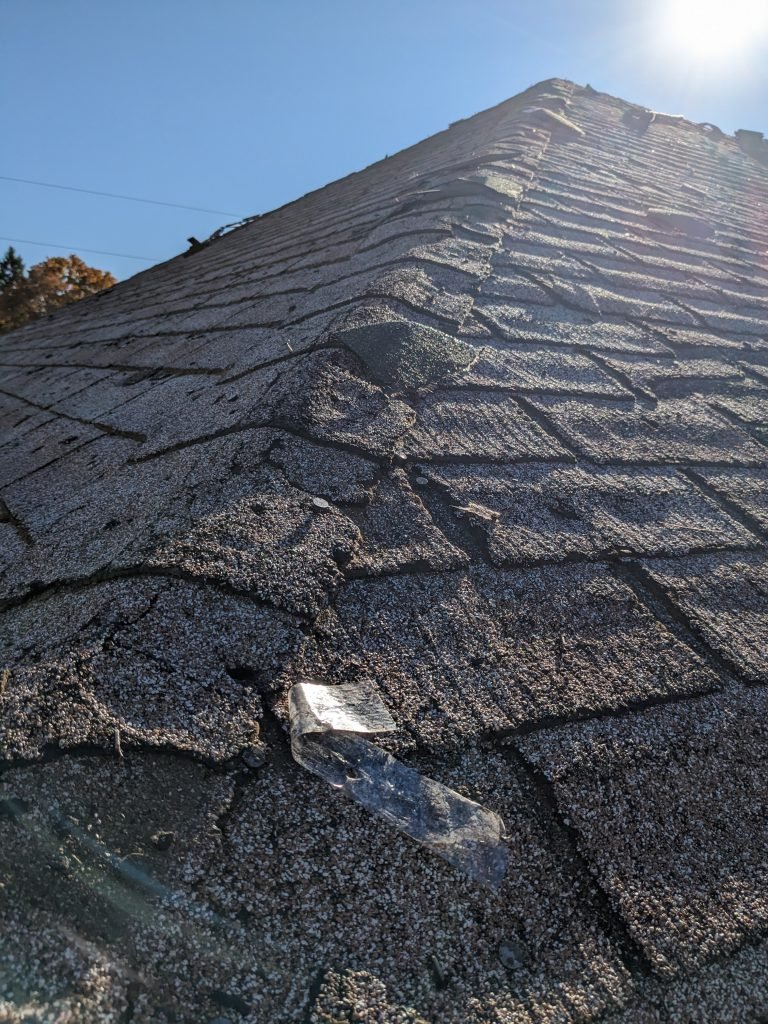 Damaged shingle roof before replacement by RC Roofing