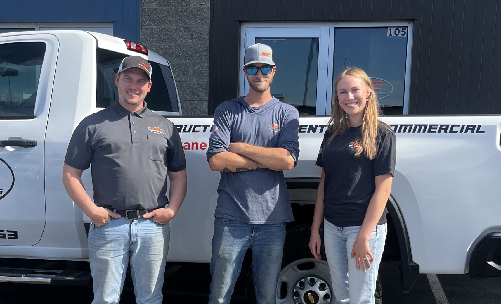 RC Roofing team stands outside together for a picture